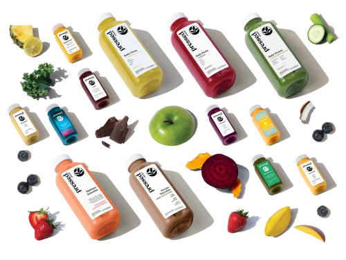 A variety of juices, shots, fruits, and vegetables.