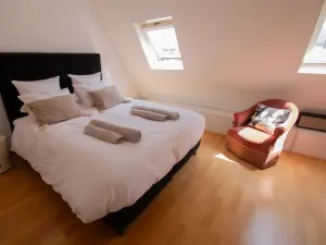 Haussmann-Style Loft with City Views in Paris's Golden Triangle