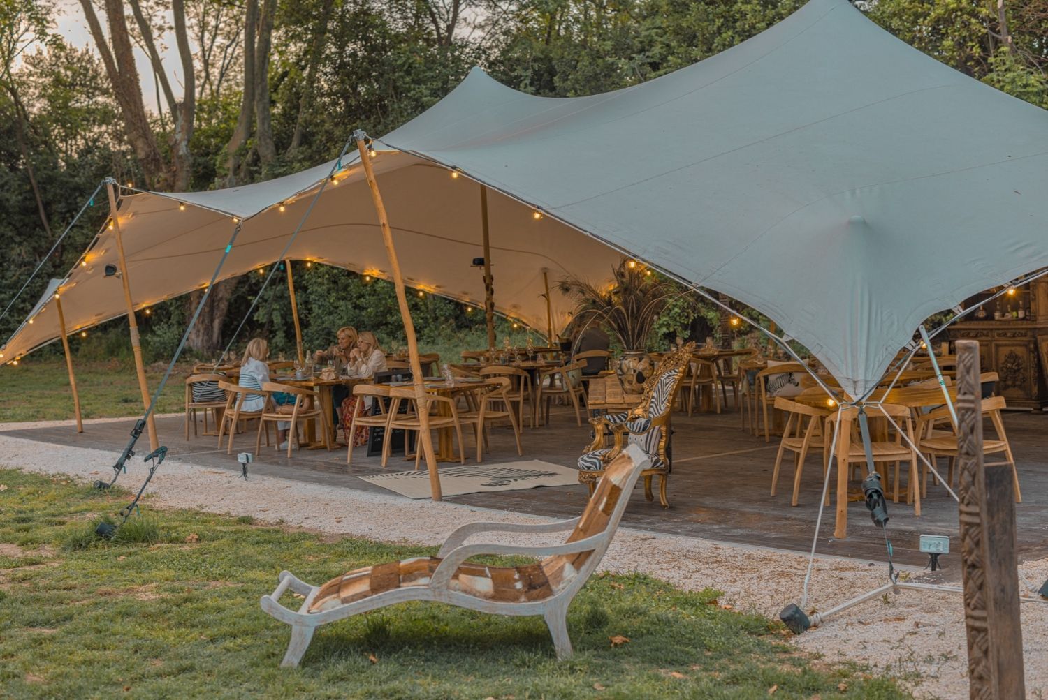 Restaurant installed under a tent in a pear orchard in Avignon