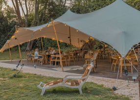 Restaurant installed under a tent in a pear orchard in Avignon