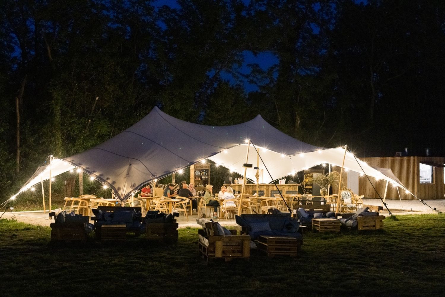 Restaurant installed under a tent in a pear orchard in Avignon
