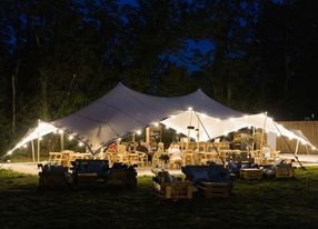 Restaurant installed under a tent in a pear orchard in Avignon