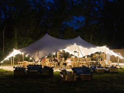 Restaurant installed under a tent in a pear orchard in Avignon