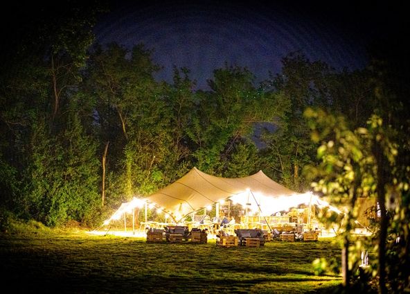 Restaurant installed under a tent in a pear orchard in Avignon