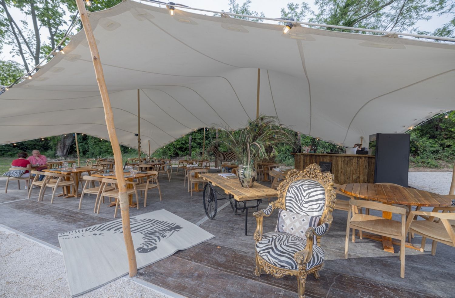 Restaurant installed under a tent in a pear orchard in Avignon