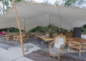 Restaurant installed under a tent in a pear orchard in Avignon