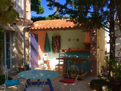 A living room, a courtyard and a terrace with a view of the good-mother
