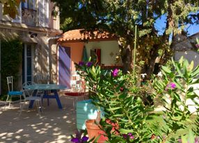 A living room, a courtyard and a terrace with a view of the good-mother