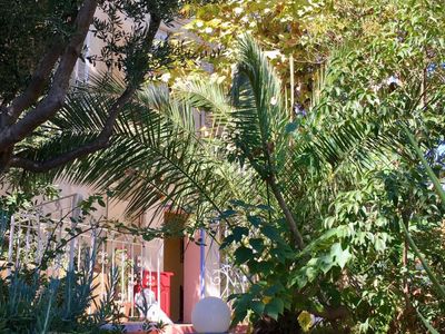 A living room, a courtyard and a terrace with a view of the good-mother