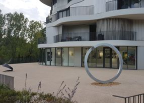 Gallery with terrace and view of greenery