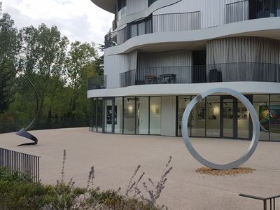 Gallery with terrace and view of greenery