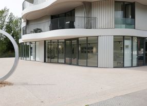 Gallery with terrace and view of greenery