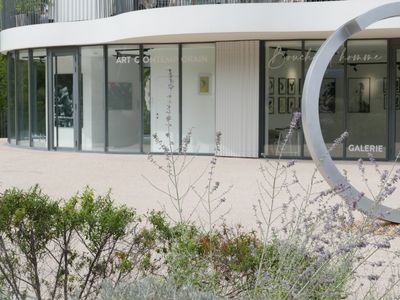 Gallery with terrace and view of greenery