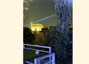 Paris terrace with Arc de Triomphe and Eiffel Tower sky view 