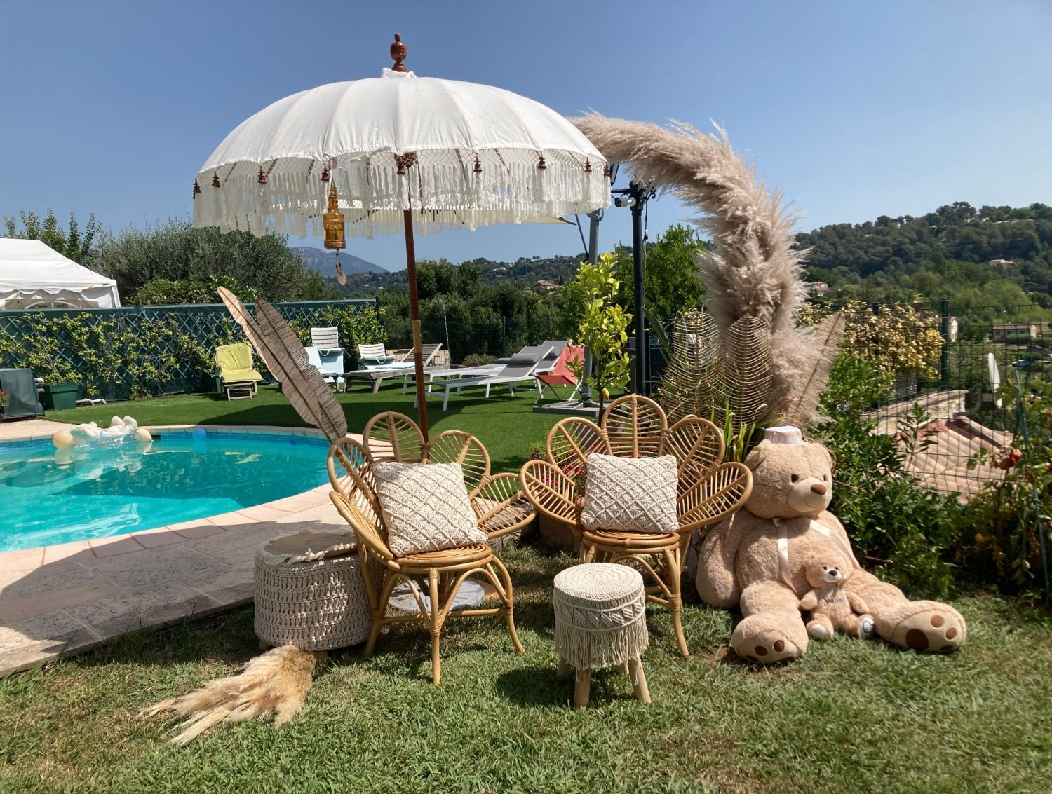 Garden with swimming pool and view of St Paul and the hills of Vence