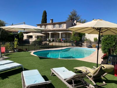 Garden with swimming pool and view of St Paul and the hills of Vence