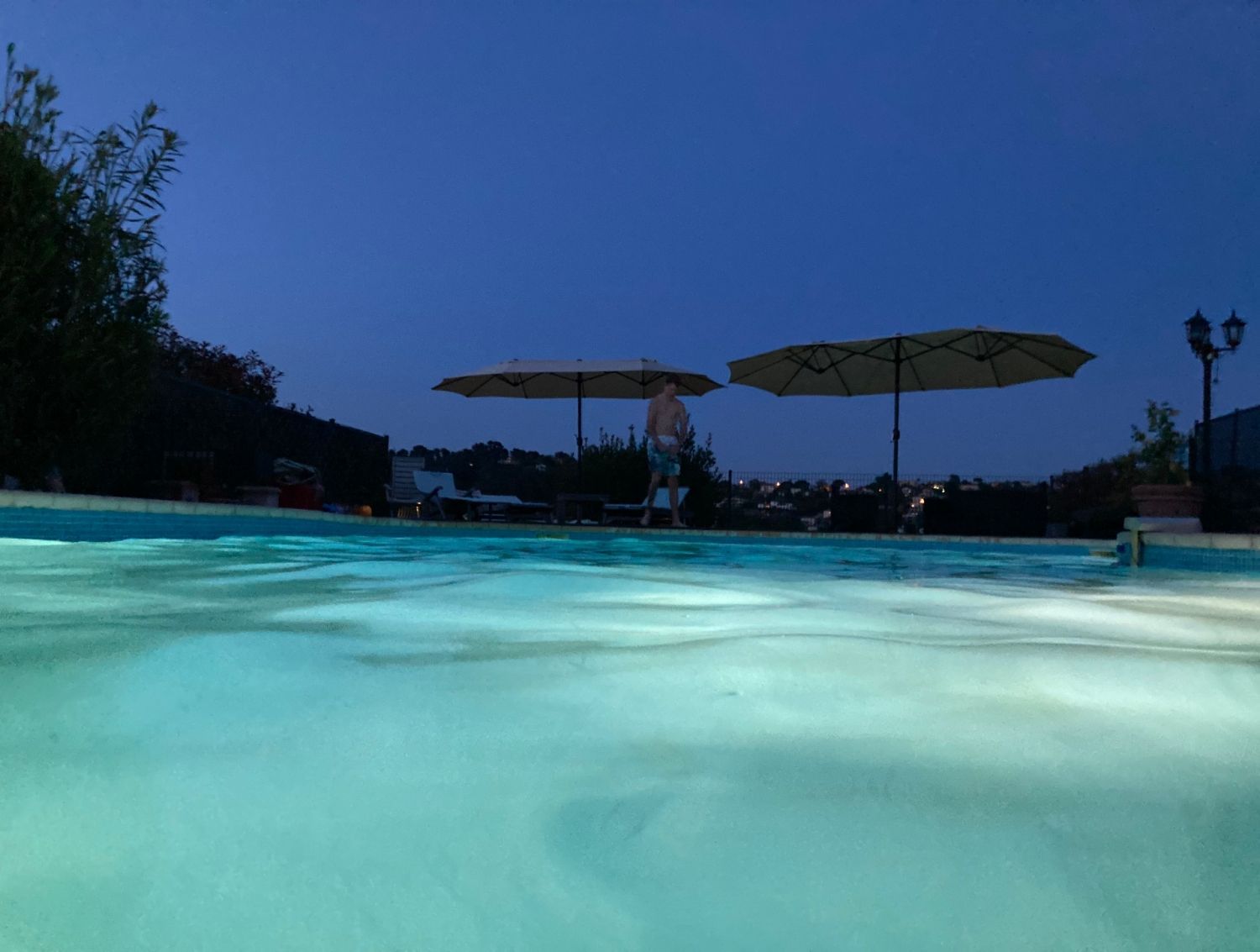 Garden with swimming pool and view of St Paul and the hills of Vence