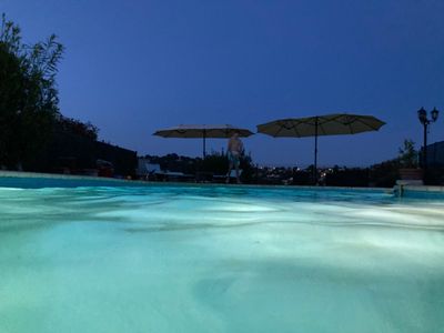 Garden with swimming pool and view of St Paul and the hills of Vence