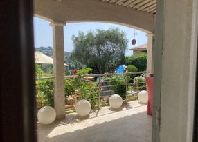 Garden with swimming pool and view of St Paul and the hills of Vence