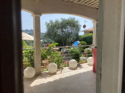 Garden with swimming pool and view of St Paul and the hills of Vence