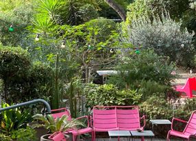 Covered terrace and outdoor terrace in a large garden in the city center