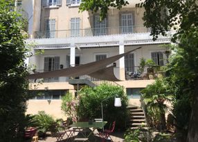 Covered terrace and outdoor terrace in a large garden in the city center