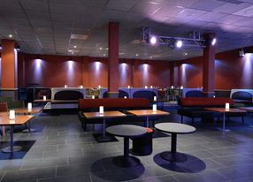 Jazz club with large bar and equipped stage