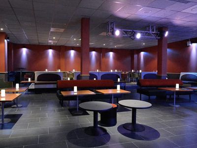 Jazz club with large bar and equipped stage