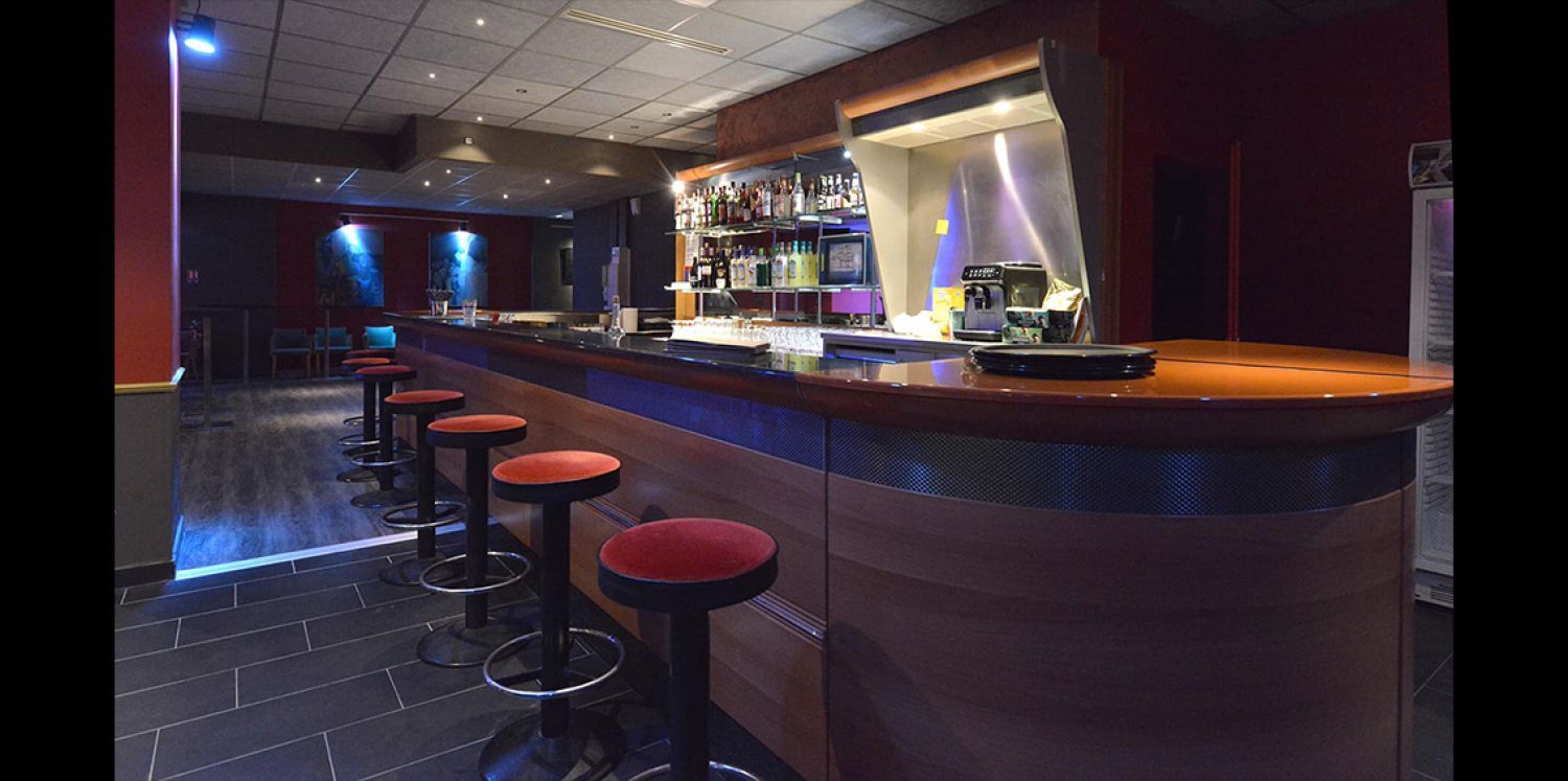 Jazz club with large bar and equipped stage