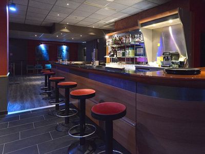 Jazz club with large bar and equipped stage