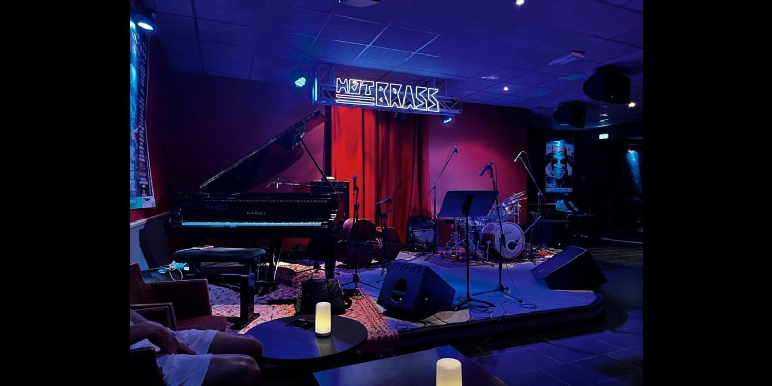 Jazz club with large bar and equipped stage