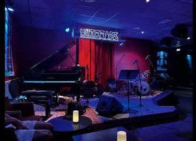 Jazz club with large bar and equipped stage