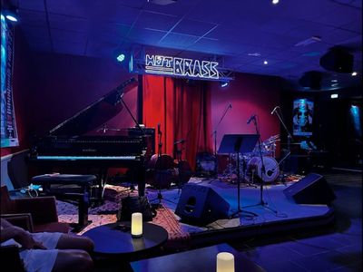 Jazz club with large bar and equipped stage