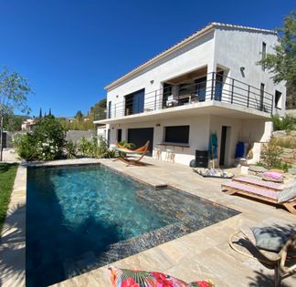 Outdoor space and a large living room with high ceilings and hill view