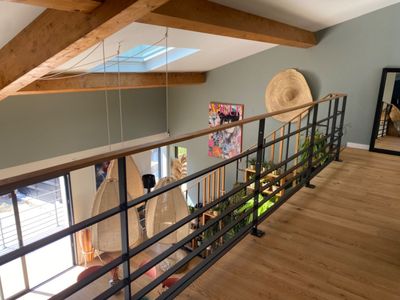 Outdoor space and a large living room with high ceilings and hill view