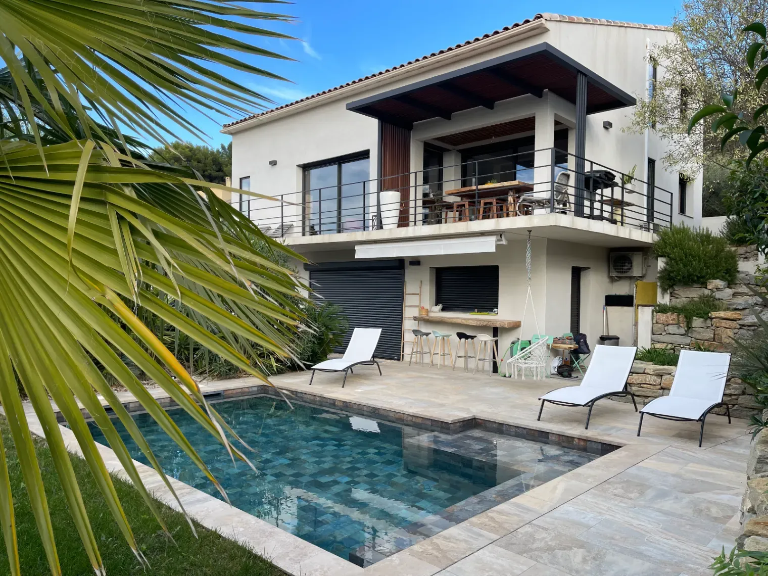Outdoor space and a large living room with high ceilings and hill view