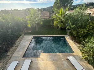 Outdoor space and a large living room with high ceilings and hill view