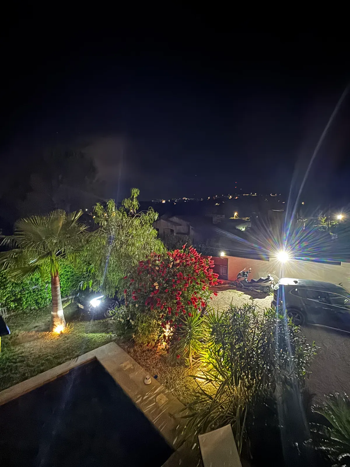 Outdoor space and a large living room with high ceilings and hill view