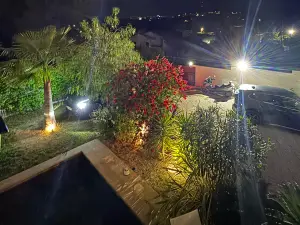 Outdoor space and a large living room with high ceilings and hill view