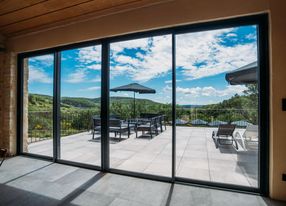 Pool house between vineyards and woods