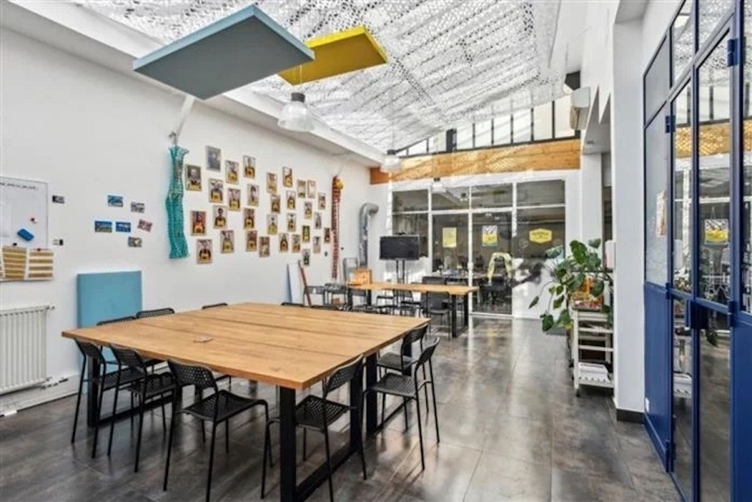 Workshop office with bright kitchen, glass roof, meeting rooms and large reception area