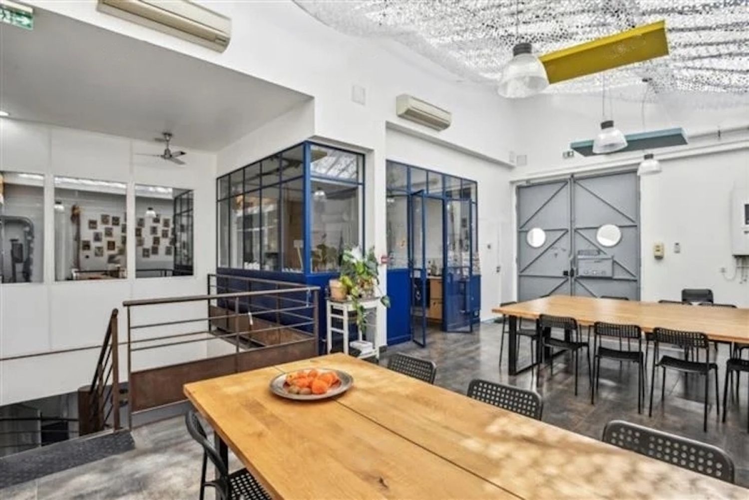 Workshop office with bright kitchen, glass roof, meeting rooms and large reception area