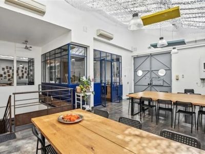 Workshop office with bright kitchen, glass roof, meeting rooms and large reception area