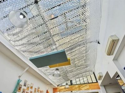 Workshop office with bright kitchen, glass roof, meeting rooms and large reception area