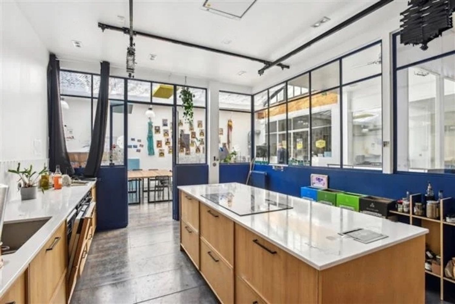 Workshop office with bright kitchen, glass roof, meeting rooms and large reception area