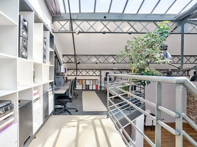 Large industrial Eiffel loft, steel, brick and glass roof