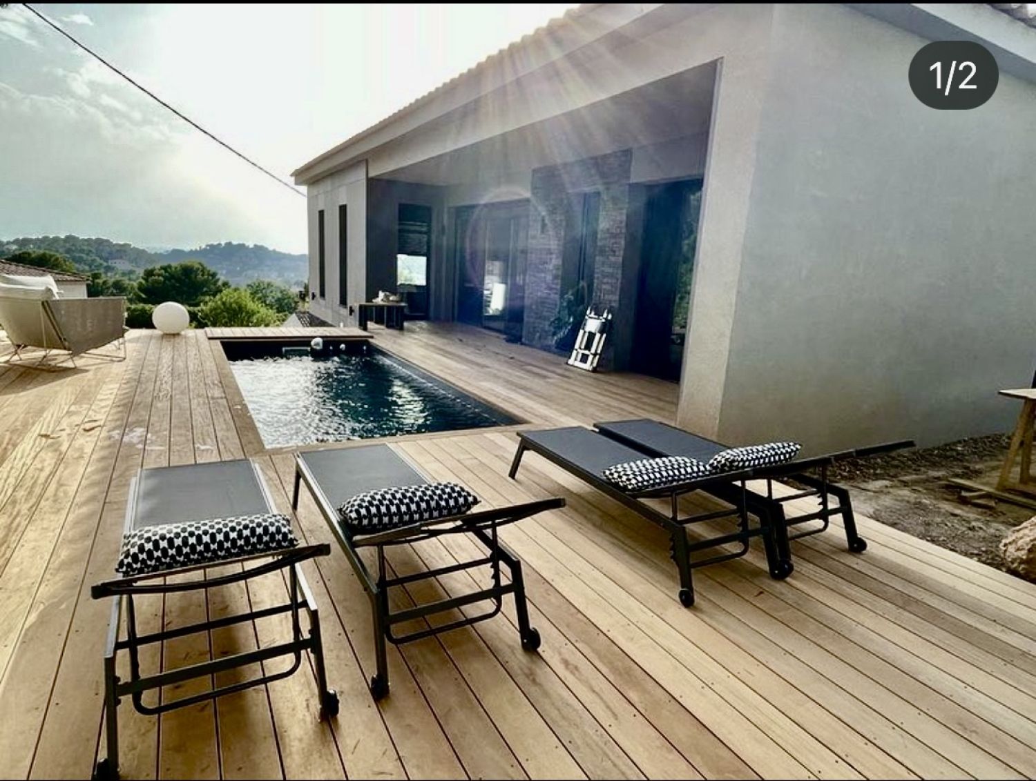 Ultra Contemporary House with Iconic 70s Furniture & Concrete Walls