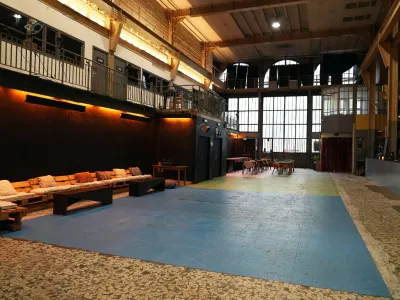 An industrial room equipped for all types of meetings and events