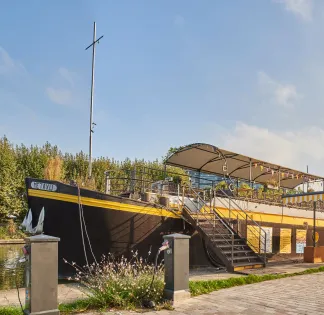 Colourful barge on the banks of the Canal de l'Ourq