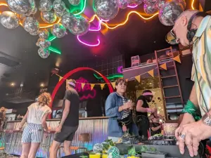 Glam Rock 80s Party Venue with Mirror Ball Ceiling & Neon Lights
